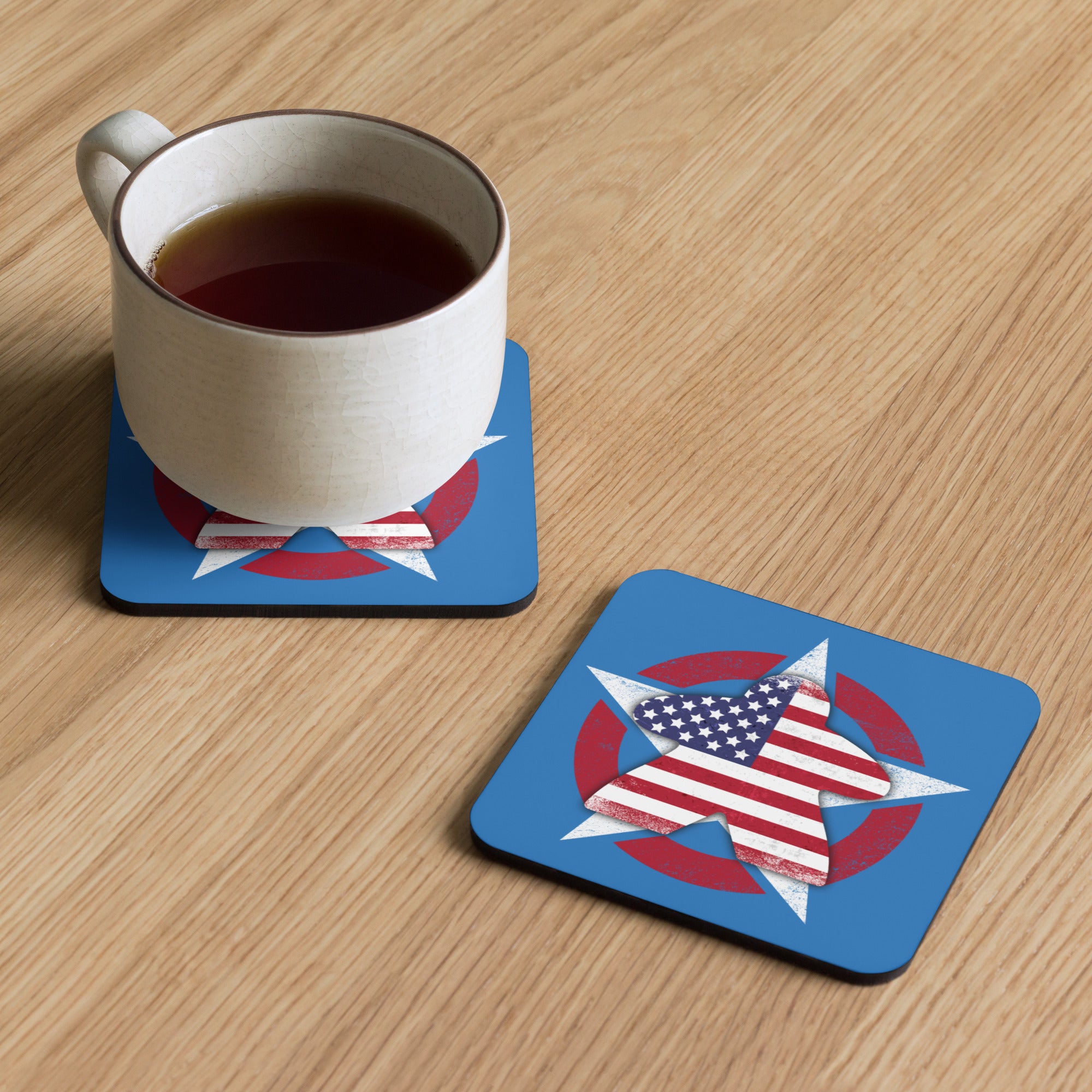 Two American Meeple coasters on table with a cup of coffee